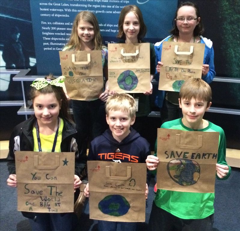 Ella White Elementary students decorate paper grocery bags to educate community about the issue of plastic pollution and marine debris on Earth Day. 