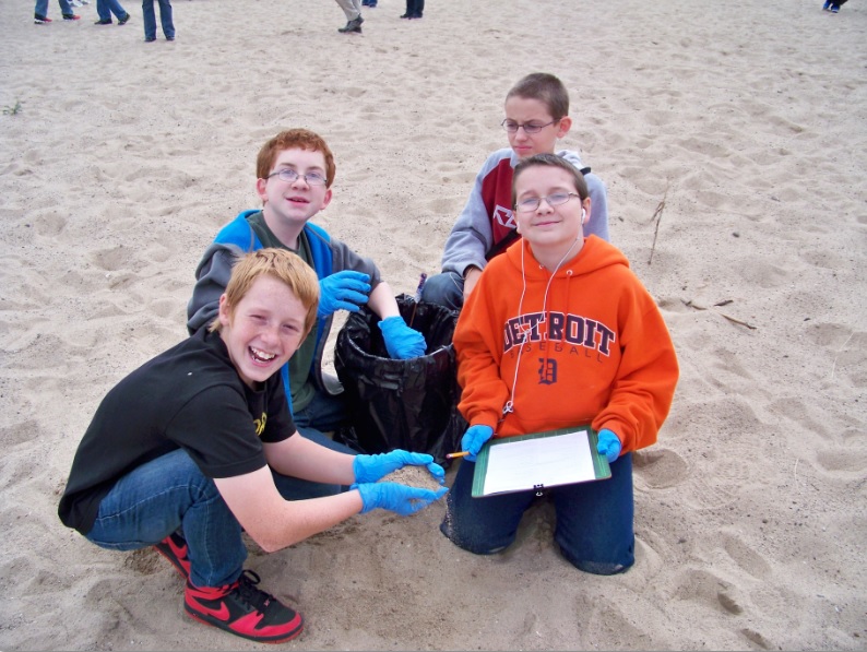 Students divided into groups to record each piece of litter collect during the beach clean-up (Sept 2013)