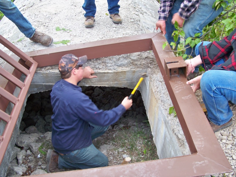 AHS students fitting the gate into the south hibernaculum.
