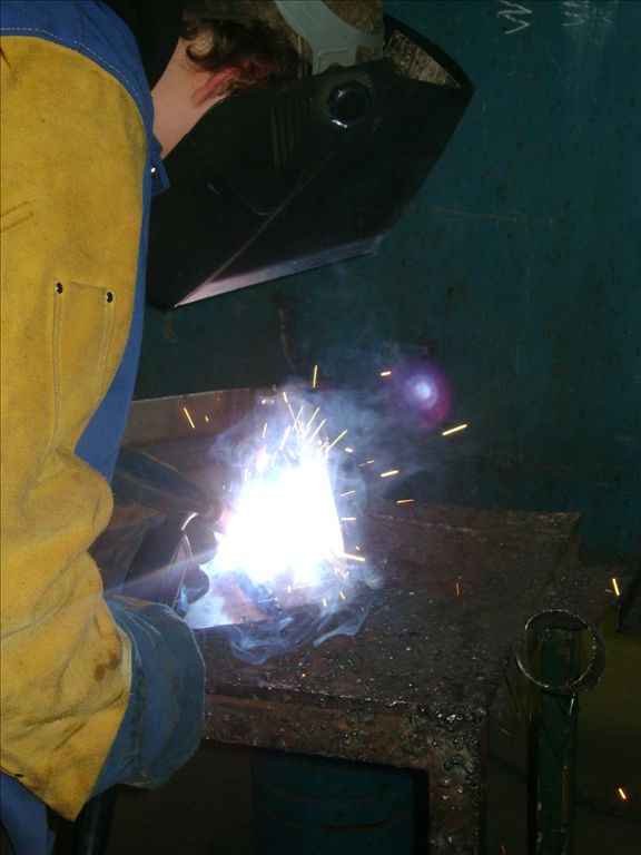 AHS industrial arts students welding the steel gates for the hibernacula.
