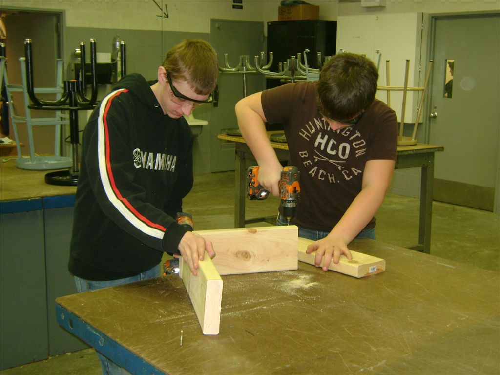 Alpena High School woodworking students building summer bat habitat houses that can be placed at Rockport State Recreation Area.