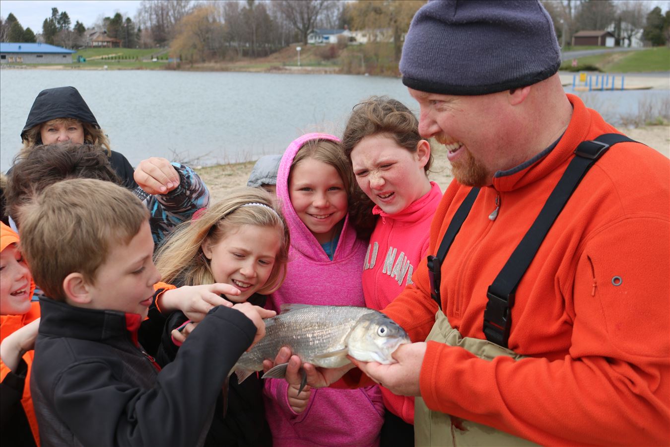 Students investigate a fish during watershed studies