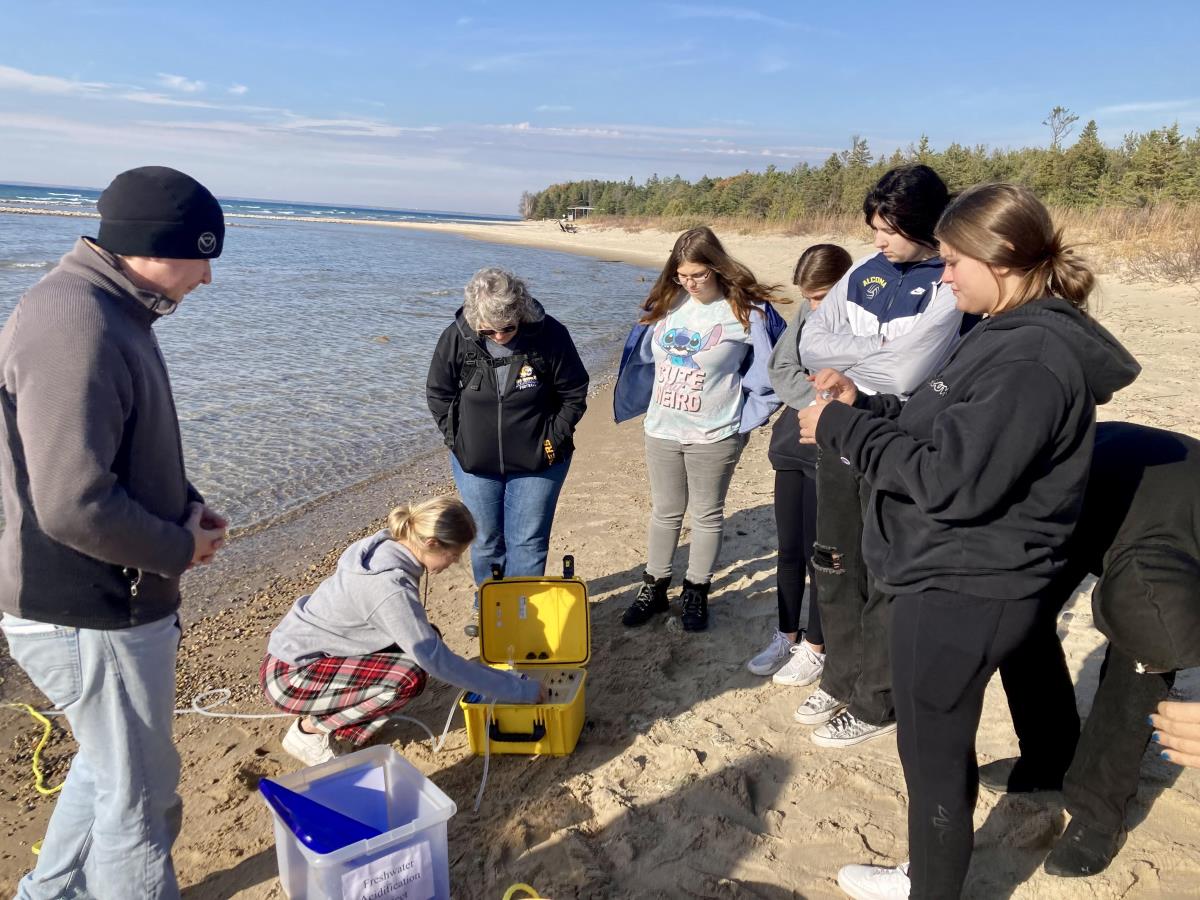 Taking PH Samples in Lake Huron